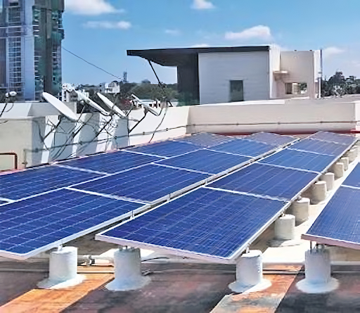 A row of blue solar panels on a rooftop