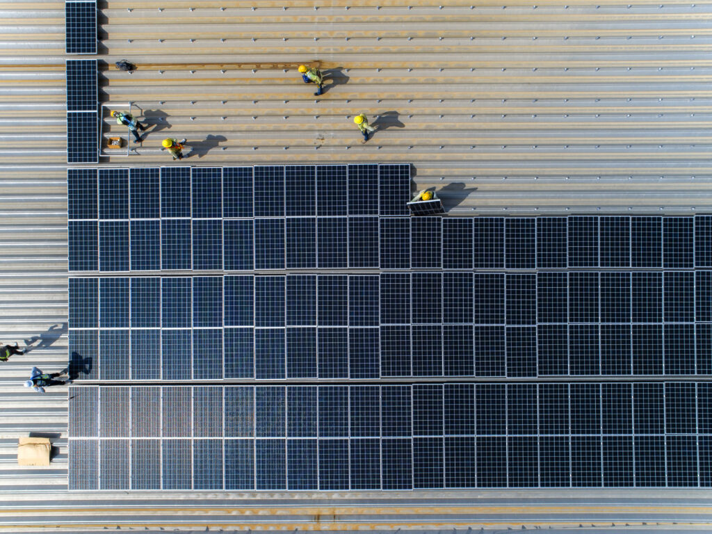 Workers,Installing,Solar,Cell,On,A,Roof.,Top,View,Solar